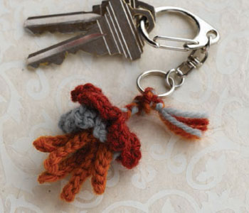 Crochet a flower for all uses, including as a key ring decoration like shown here. Crochet a flower for all uses, including as a key ring decoration like shown here