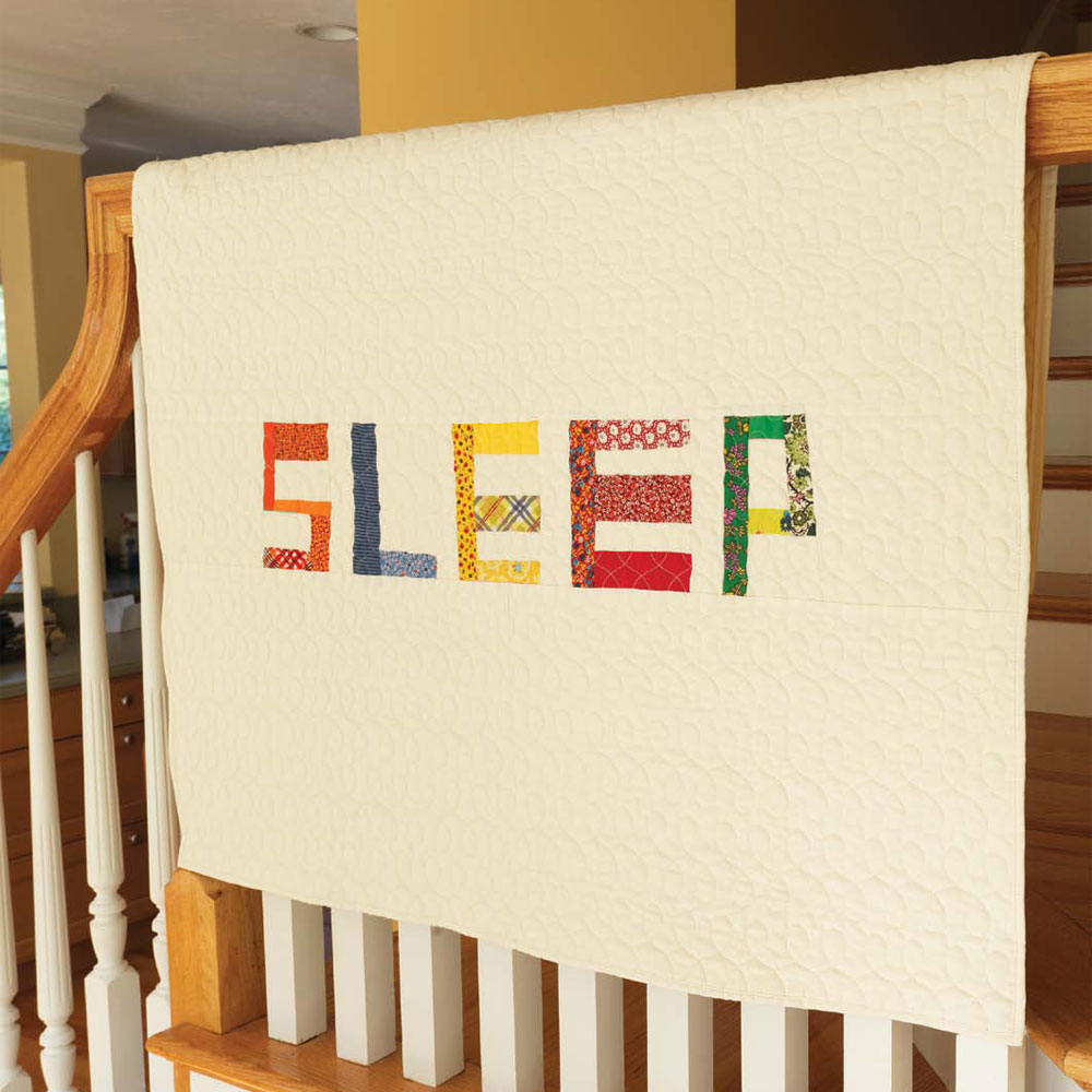 Get two baby quilt patterns for beginners in this collection, including this sleep quilt.