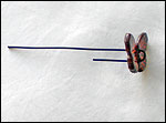 Bending wire through button holes