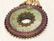 Shimmering Shells Lariat by Cynthia Rutledge engraved shell pendant bezeled by peyote stitch
