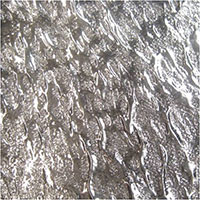 Hammered with the textured edge of a jeweler’s hammer.