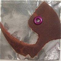 Leather scrap added with an eyelet.