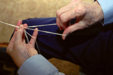 Learn how to Navajo ply and how the chain plying technique creates a three-ply yarn chain-plying
