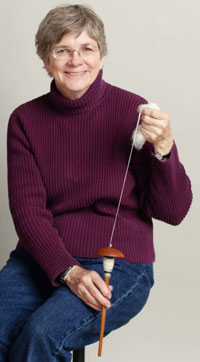 Maggie Casey demonstrates spindle spinning