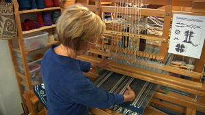 Madelyn at her loom