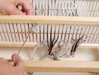Threading the second heddle