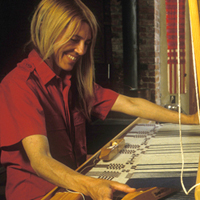 Madelyn weaving a coverlet on a shaft drawloom