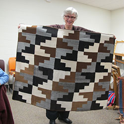 Marilyn Murphy with handwoven piece from Pitumarca, Peru