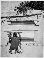 A Navajo weaver at work