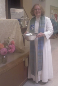 Sarah conducts a service in her handwoven stole