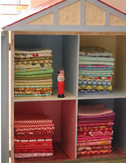 Lisa's childhood dollhouse keeps favorite fat quarters dust-free. Lisa's childhood dollhouse keeps favorite fat quarters dust-free.