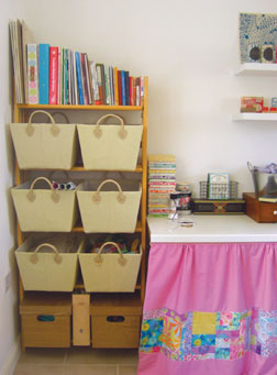 Lucie organizes her fabric and supplies and in open bins for easy access. Lucie organizes her fabric and supplies and in open bins for easy access.